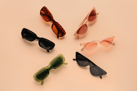 Stylish sunglasses on beige backgroundの写真素材