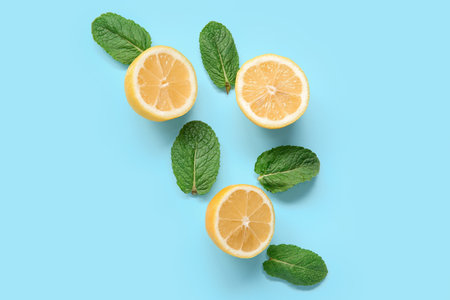 Fresh lemons with mint on blue backgroundの写真素材
