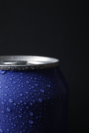 Lilac can of fresh soda with water drops on dark background, closeupの写真素材