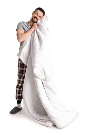 Handsome man with soft blanket on white backgroundの写真素材