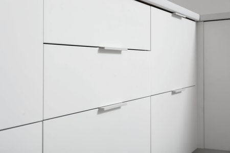 White drawers in modern kitchen, closeupの写真素材