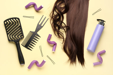 Brown hair with accessories on yellow backgroundの写真素材