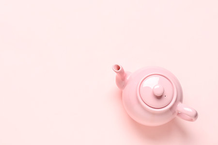 Ceramic teapot on pink backgroundの写真素材