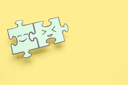 Puzzle pieces with happy faces on beige background. friendship day celebrationの写真素材