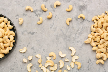 Tasty cashew nuts on grunge backgroundの写真素材