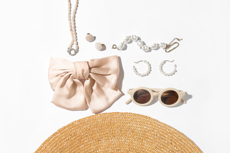 Jewelry with sunglasses and summer hat on white backgroundの写真素材