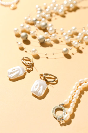 Stylish jewelry on beige background, closeupの写真素材