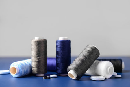 Different thread spools and buttons on color table