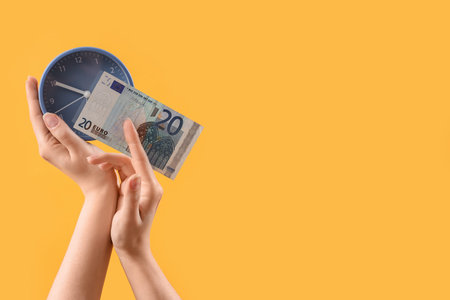 Woman with euro banknote and clock on yellow background