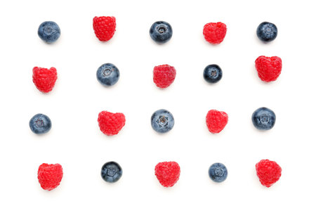 Ripe raspberry and blueberry on white backgroundの写真素材
