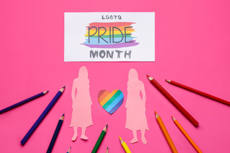 Card with text LGBTQ PRIDE MONTH, paper female figures, heart and pencils on pink backgroundの写真素材