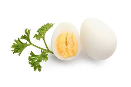 Boiled quail eggs with parsley on white backgroundの写真素材