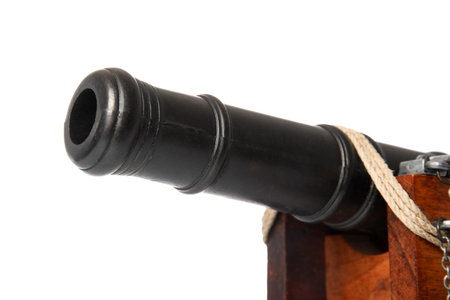 Toy model of cannon isolated on white background, closeup