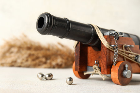 Toy model of cannon on light background, closeupの写真素材