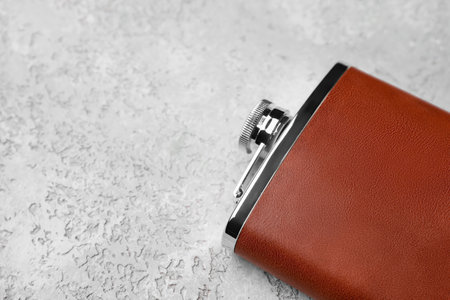 New hip flask on light background, closeupの写真素材