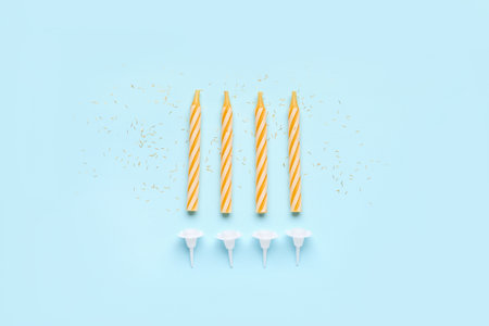 birthday candles on blue backgroundの写真素材