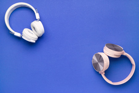 Modern headphones on blue backgroundの写真素材