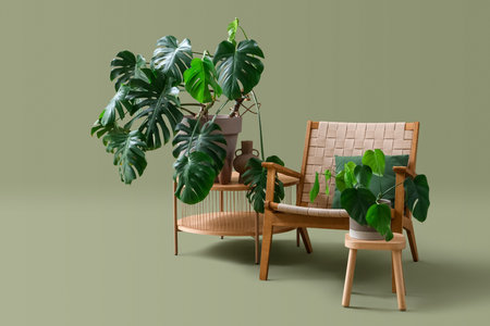 Tables with houseplants and armchair on green backgroundの写真素材