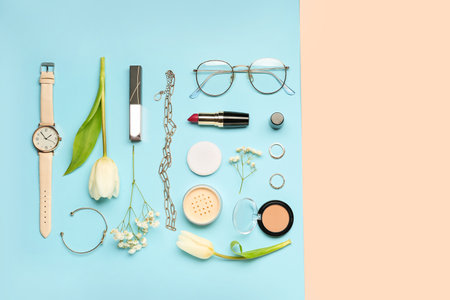 Composition with female accessories, cosmetics and flowers on color backgroundの写真素材