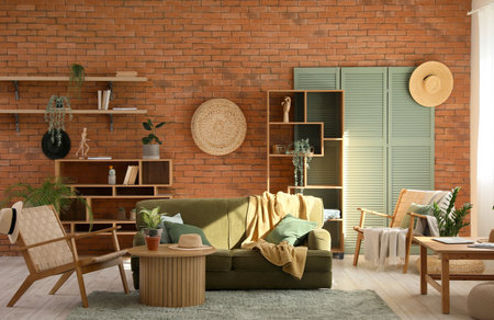 Interior of stylish living room with green sofa, armchair and coffee tableの写真素材