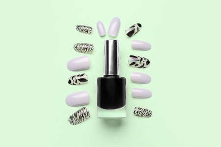 Press-on nails with polish on green backgroundの写真素材