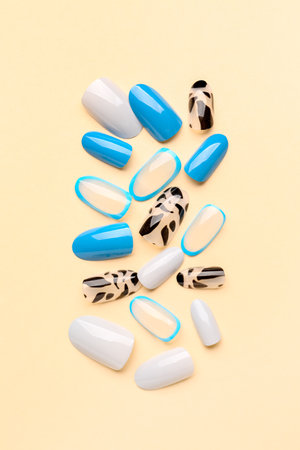 Press-on nails on beige backgroundの写真素材