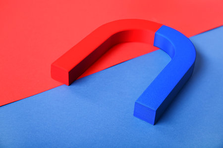 Horseshoe shaped magnet on color backgroundの写真素材