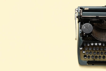 Vintage typewriter on light yellow backgroundの写真素材
