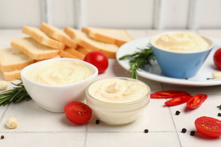 Bowls of tasty cream cheese on tableの写真素材