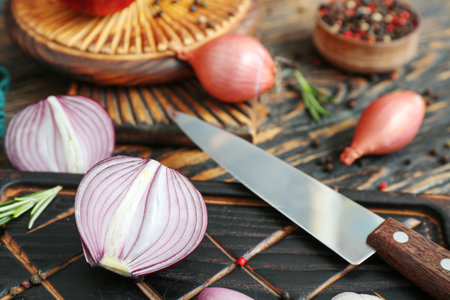 Boards with different kinds of onion on brown wooden backgroundの写真素材
