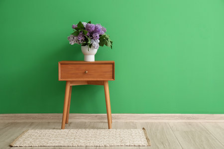 Interior of room with table and bouquet of lilac flowersの写真素材