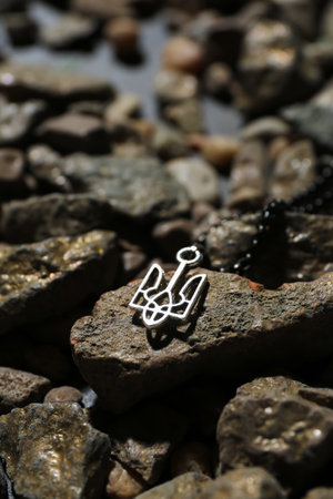 Chain with Ukrainian coat of arms on stones, closeupの写真素材