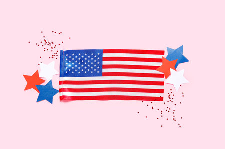 USA flag, stars and confetti on pink background. independence day celebration