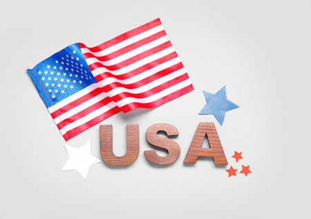 Text USA, flag of America and stars on gray background. independence day celebrationの写真素材