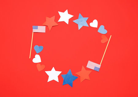 Frame made of USA flags, stars and hearts on red background. independence day celebration