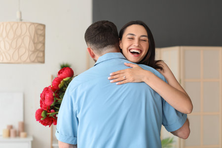 Happy busy couple hugging at homeの写真素材