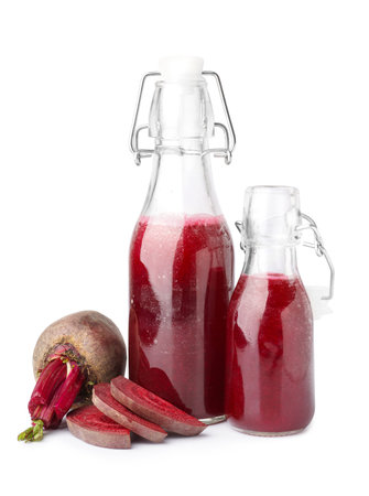 Bottles of healthy beet juice on white backgroundの写真素材