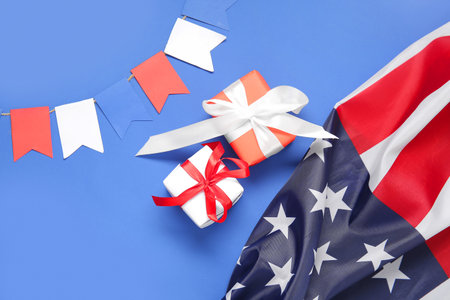 Gift boxes with USA flag and garland on blue background. american independence dayの写真素材