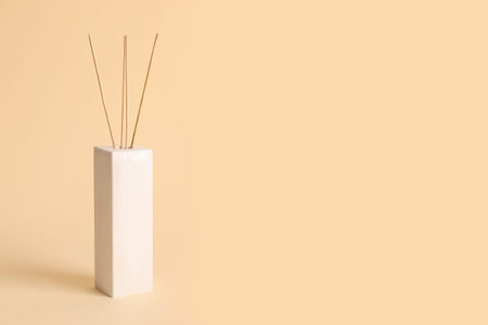 Reed diffuser on beige background