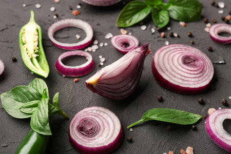 Fresh onion, jalapeno and spices on dark background, closeupの写真素材