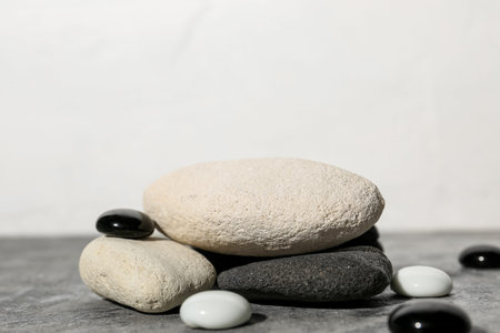 Decorative stone podiums on gray table