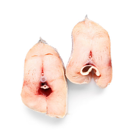 Pieces of raw codfish on white background