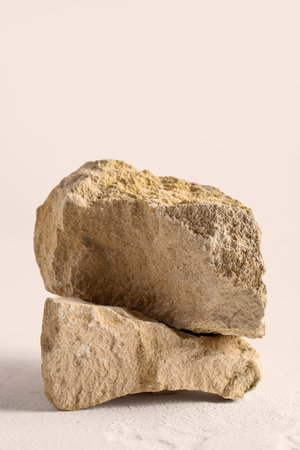 Decorative stone podiums on white textured tableの写真素材