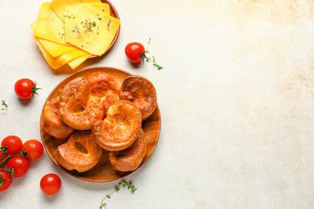 Plate with tasty Yorkshire pudding on light backgroundの写真素材