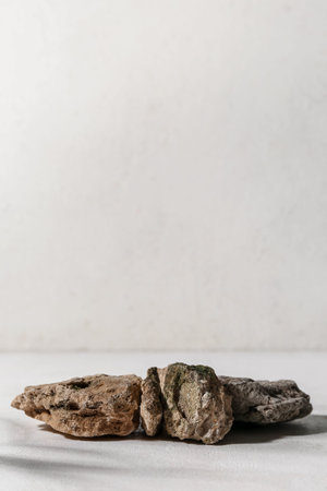 Decorative stone podiums on white table