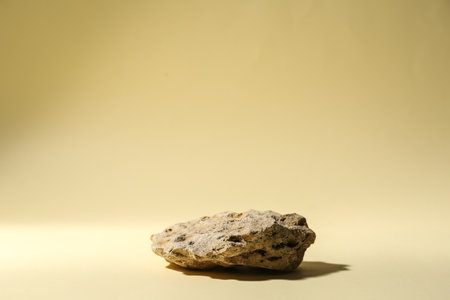 Decorative stone podium on beige backgroundの写真素材