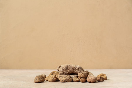 Decorative stone podiums on beige table