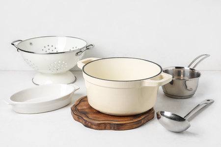 Set of different kitchen utensils on light backgroundの写真素材