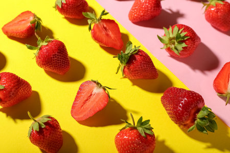 Many fresh strawberries on colorful backgroundの写真素材