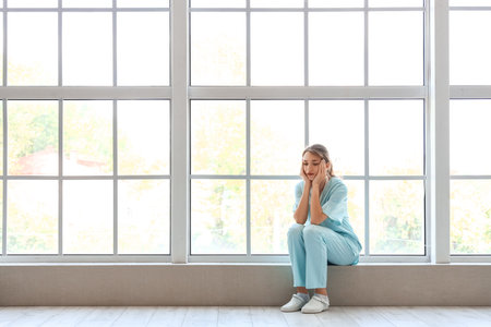 Stressed female medical intern at hospitalの写真素材